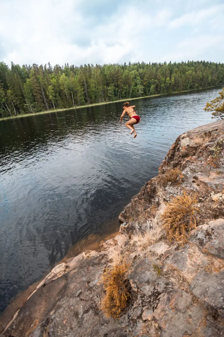 person jumping lake