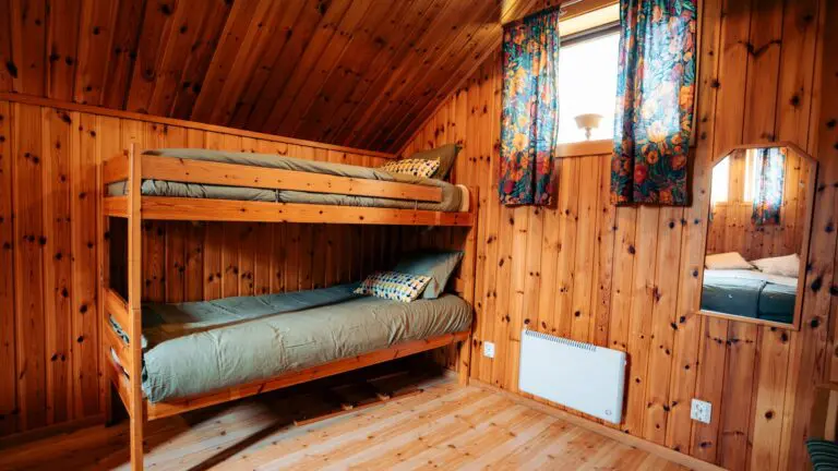 bunk beds in a cozy wooden cabin room