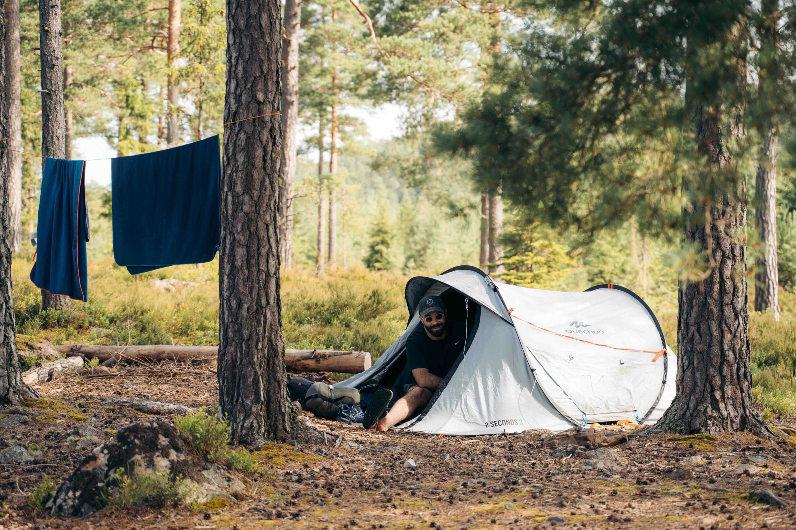 A man waking up in his tent